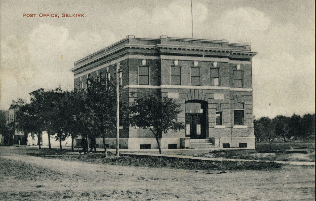 Black and white image on a post card of the old post office building