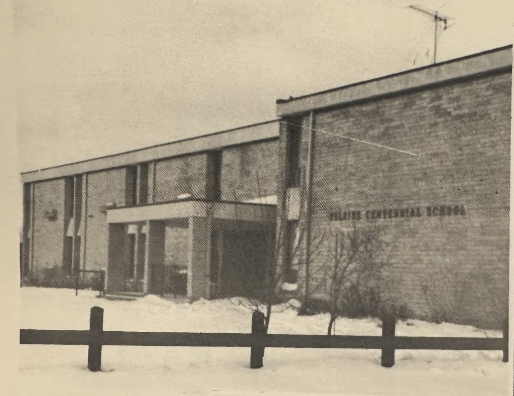 Black and white photo of Centennial School in the winter time