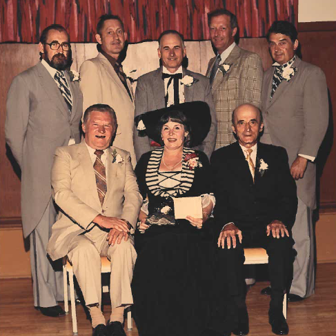 Selkirk Town Council, 1974-1978, Selkirk Museum Collection Colour image of a group of people sitting and standing posing for a picture