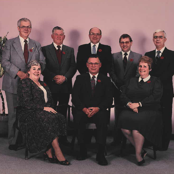 Selkirk Town Council, 1986-1989, Selkirk Museum Collection Colour image of a group of people sitting and standing posing for a picture