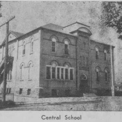 Central School, 1959, Selkirk Enterprise A black and white image of a three story school house. At the bottom of the photo there is a caption which reads 'Central School'
