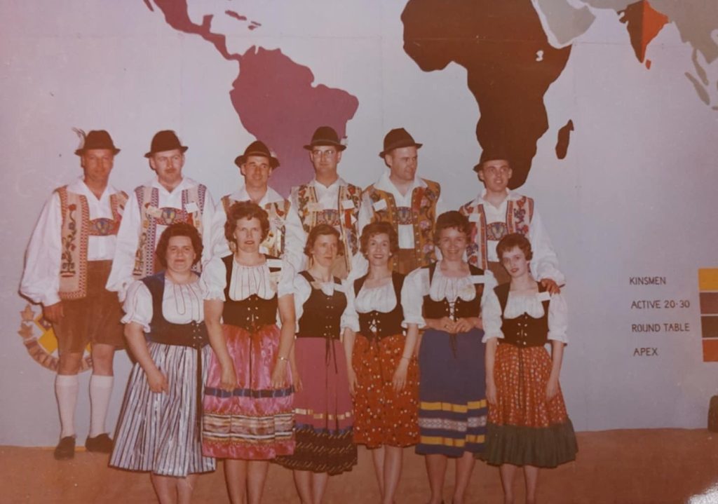 Colour image of a group of people dressed up in traditional German attire