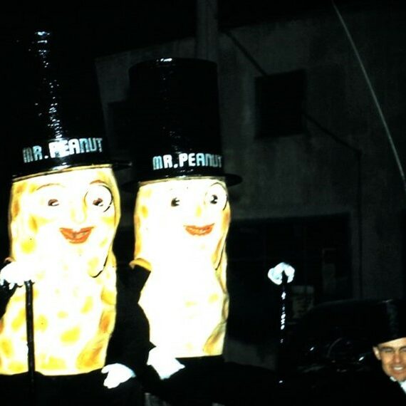 Colour photo of two people dressed up as peanut men