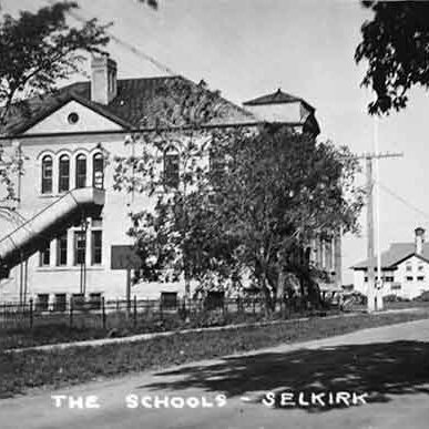 Selkirk Central School and Devonshire in the Background, 1937, Archives of Manitoba, George Harris Fonds, Album 20, Page 46 A black and white image of Central School and Devonshire School in the background