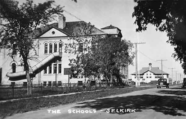 A black and white image of Central School and Devonshire School in the background