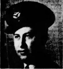 Black and white photo of a soldier looking to the left of the camera. He wears a military cap