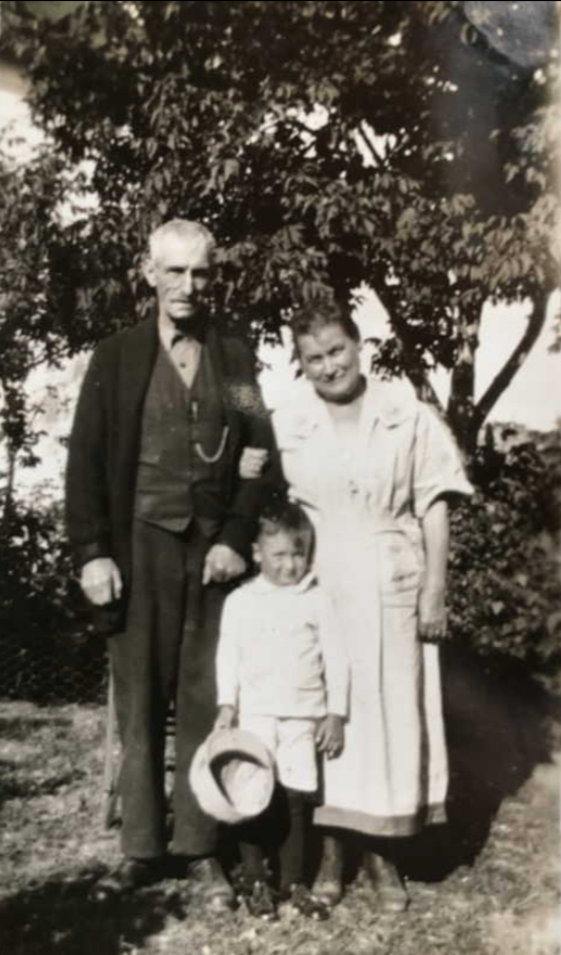 Black and white photo of a man and a woman with a child in between them