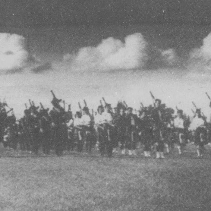 Gathering Chieftain Dick Johnstone, 1986, Selkirk Journal Black and white image of bagpipe players gathered together in a march