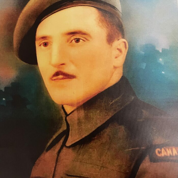 Jack C. Laye, 1942-1945, Laye Family Colour image of a painting of John (Jack) Cy Laye in military uniform. He looks to the left of the camera. He has a mustache and a badge on his shoulder which says 'Canada'