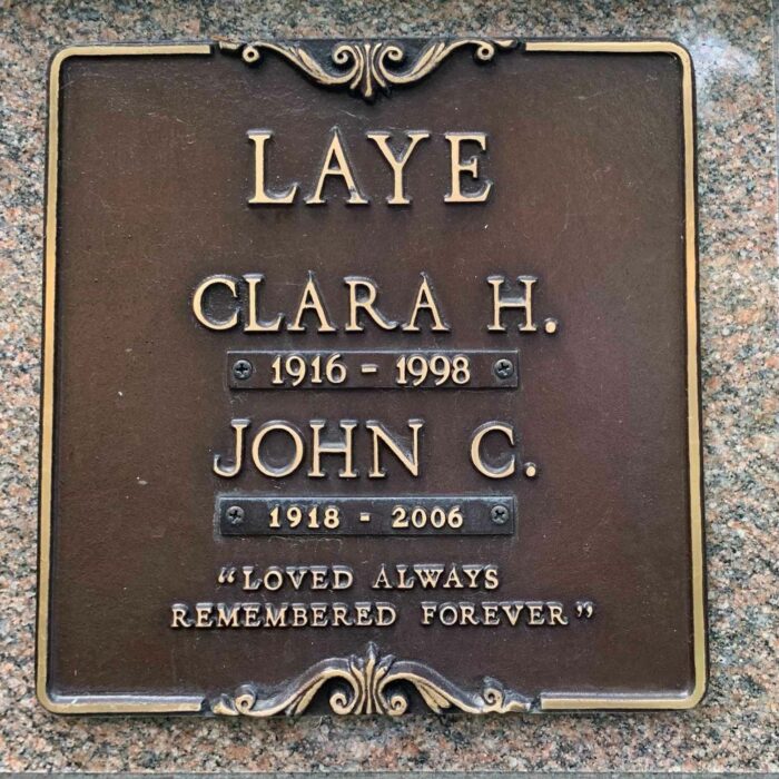Jack C. Laye, 2021, Find A Grave Colour image of a gravestone. The stone is grey with a metal plaque. The family name 'Laye' is on the top. Below the family name is 'Clara H', dates, 'John C.' and more dates. At the bottom it reads "Loved always remembered forever"