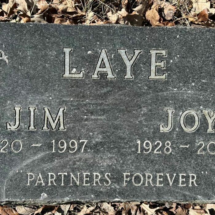 Jim Laye, 2025, Find A Grave A colour image of a gravestone with the family name 'Laye'. Under the family name is Jim and Joy along with their birth and death dates. At the bottom of the stone reads 'partners forever'
