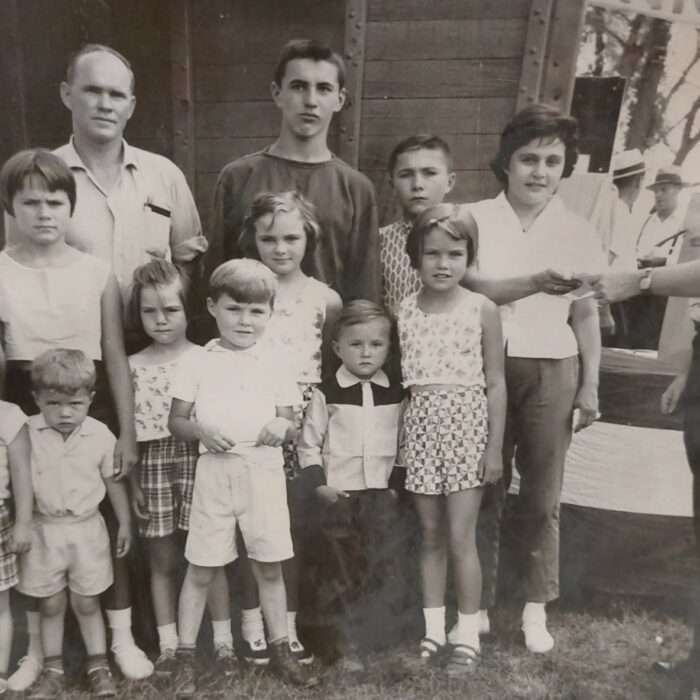John V. Sinclair and His Ten Children, Date Unknown, Selkirk Museum Collection Black and white image of a large family of children. Their father is at the back left