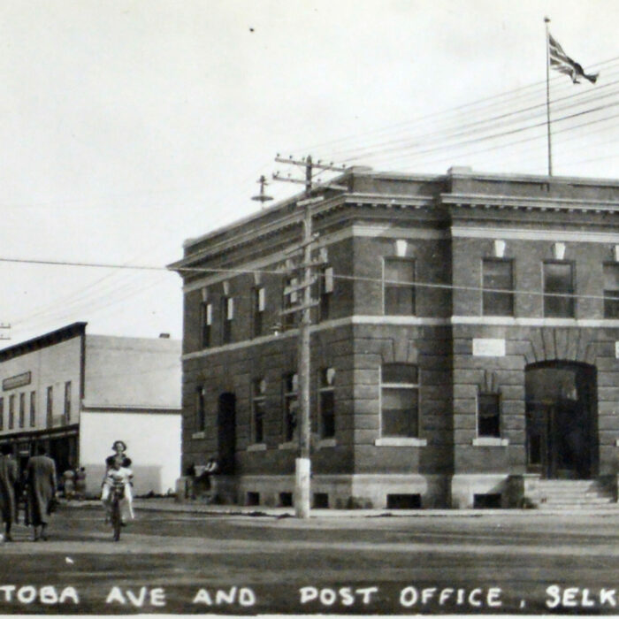 Manitoba Ave and Post Office, c1930s, Archives of Manitoba, George Harris Fonds Black and white image of the Old Post Office from across Main Street