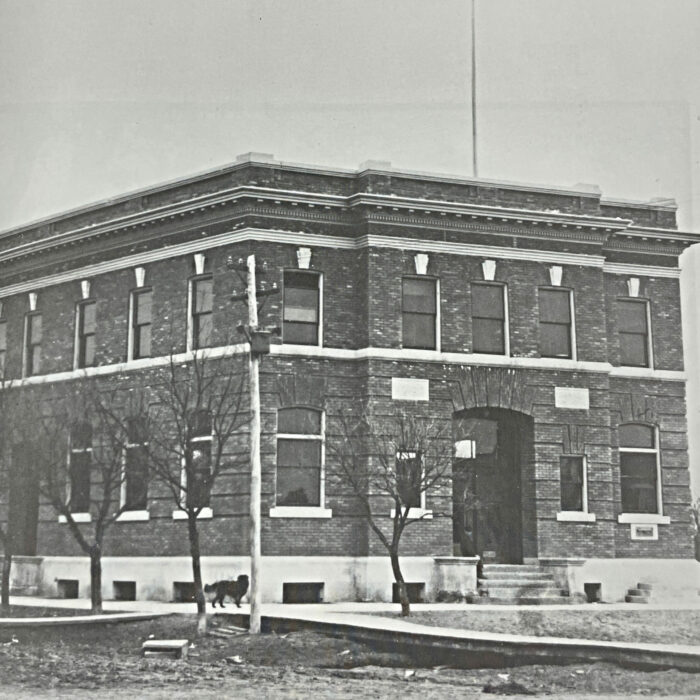 Post Office Selkirk, 1909, Public Archives Canada Black and white image of the post office from across main street. There is a dog walking down the sidewalk