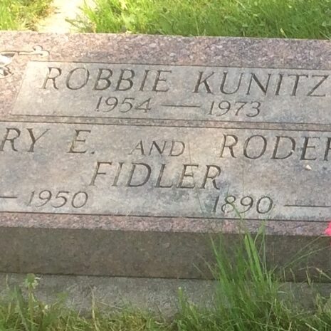 Roderick Fidler Gravestone, 2014, Find A Grave A colour image of a red gravestone. The stone has white rectangular spaces where the names are listed with the natural red stone colour making up the lettering
