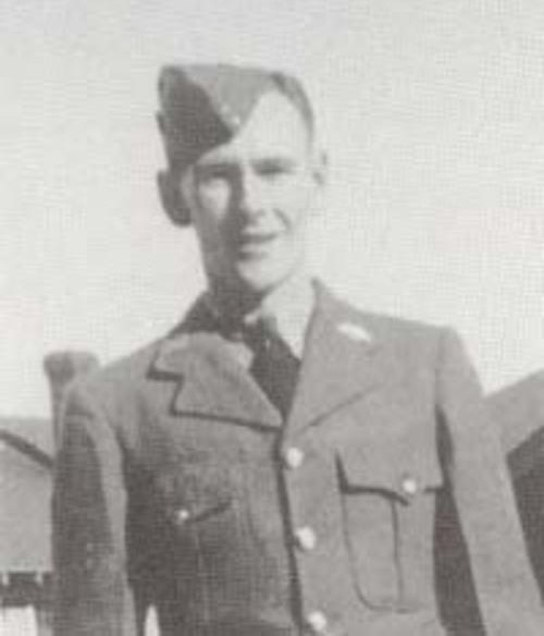 A black and white image of a young man in military uniform. He looking at the camera
