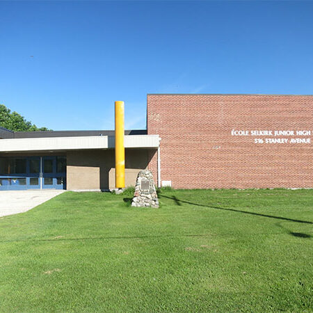 École Selkirk Junior High, 2016, Manitoba Historical Society Colour image of a school. On the right side of the image is a large brick gymnasium. On the left is the school's entrance