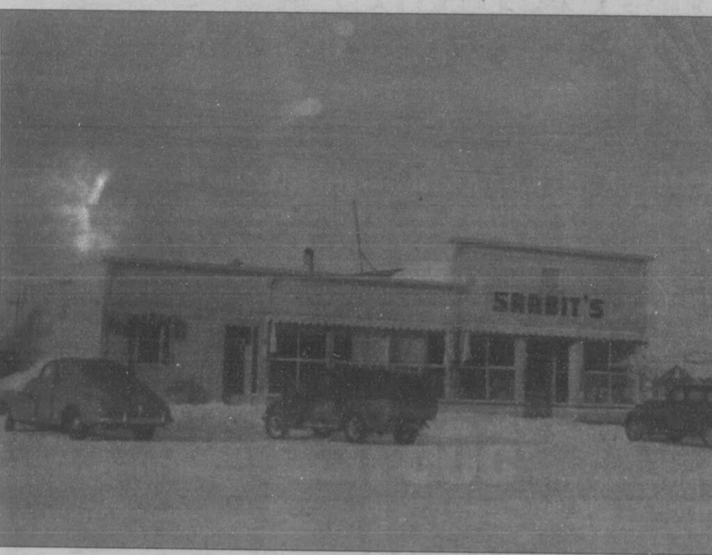 Black and white photo of the exterior of Sarbit's Grocery store