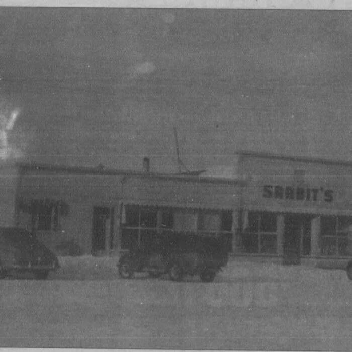 Black and white photo of the exterior of Sarbit's Grocery store