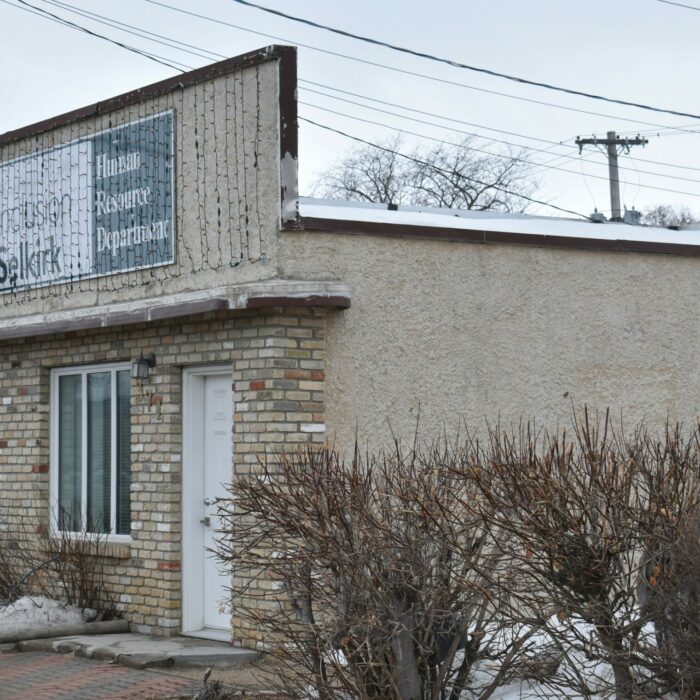 371 Eveline, Dr. Easton's Office, 2020, Peter Hall Colour photo of a three-quarter view of a small beige building on Eveline Street
