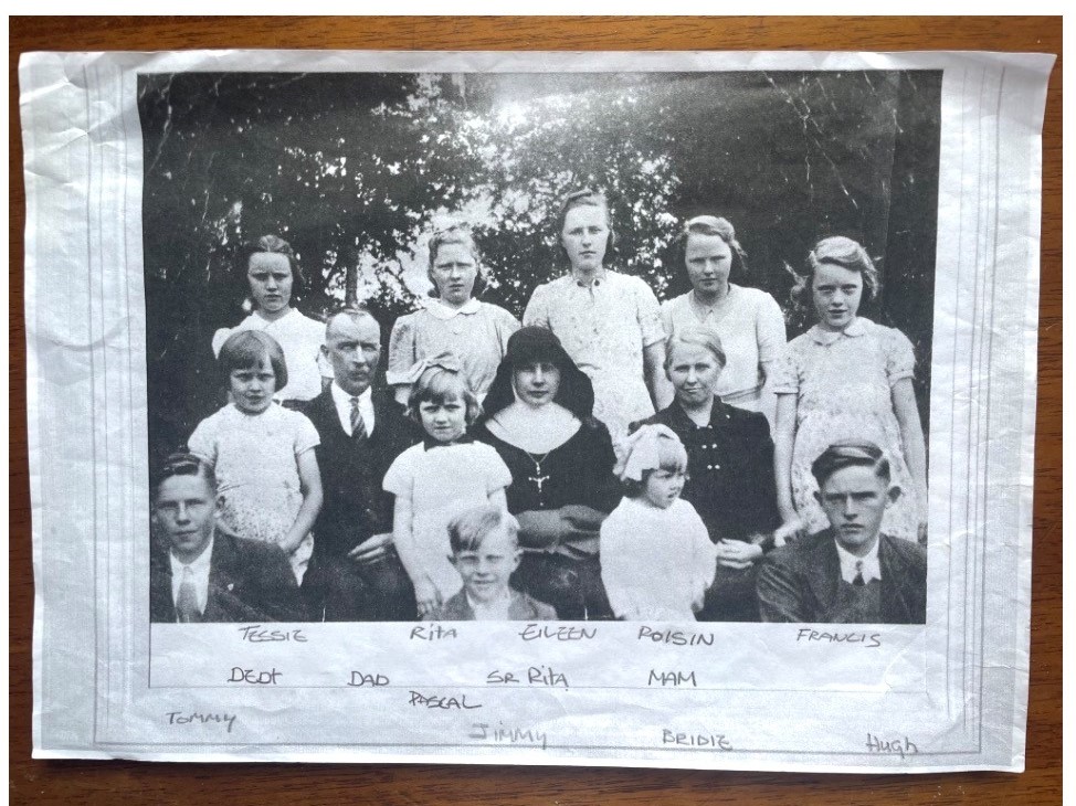 Black and white photo of a family.