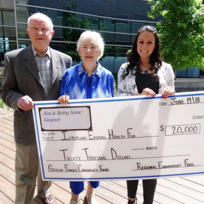 Colour photo of Jim and Betty Anne Gaynor holding a cheque