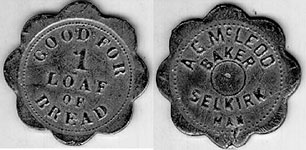 Black and white photo of two bread tokens from McLeod's Bakery