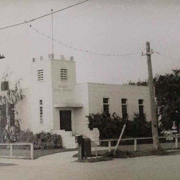 Civic Office, c1947, Selkirk Remembered by Hugh H. Gibbs Black and white photo of civic office. The building is rectangular with a tower structure on the left hand side of the frame. There are three photos on the right side of the building