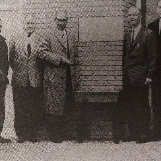 Laying of Cornerstone at the Civic Offices, 1960, Selkirk Enterprise Centennial Edition Black and white photo of a a group of men standing around a brick wall and plaque