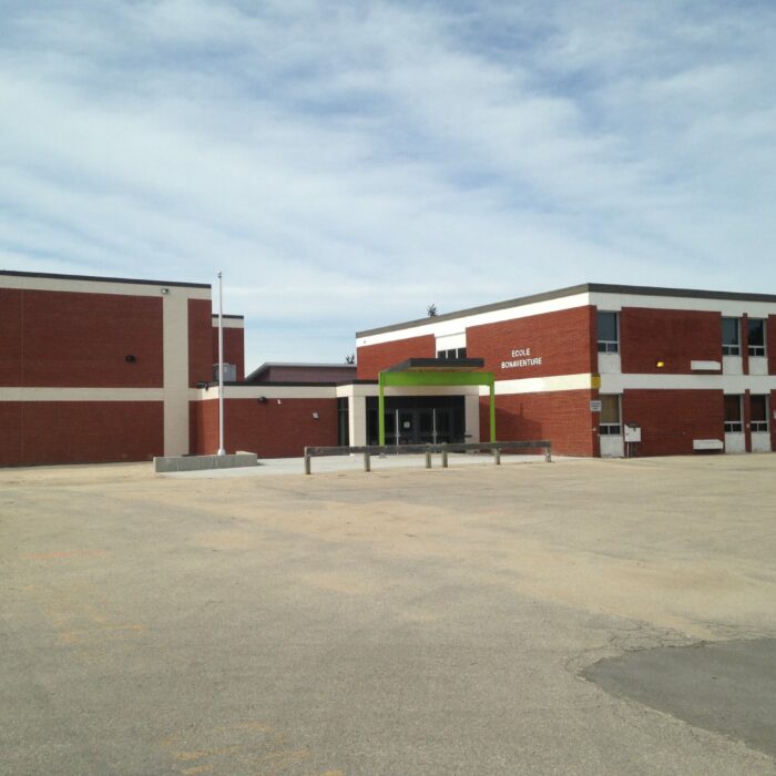 New École Bonaventure School, 2015, Cecile Barrett Colour photo of a red brick school with white trim