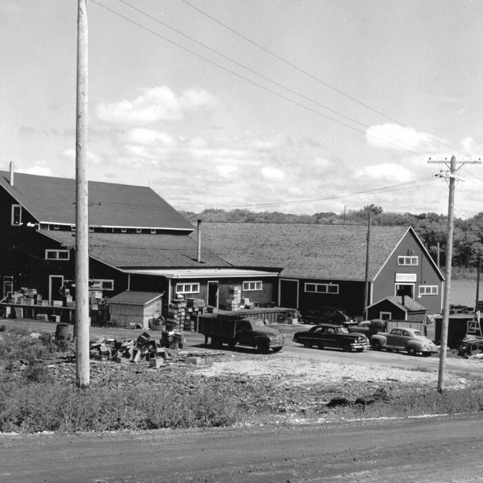 Booth Fisheries, 1957, Red River North Heritage Black and white photo of a series of buildings along the river