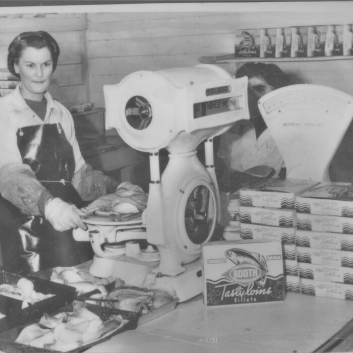 Female Booth Fisheries Worker, 1934-1935, Booth Fisheries Black and white photo of women working at Booth Fisheries