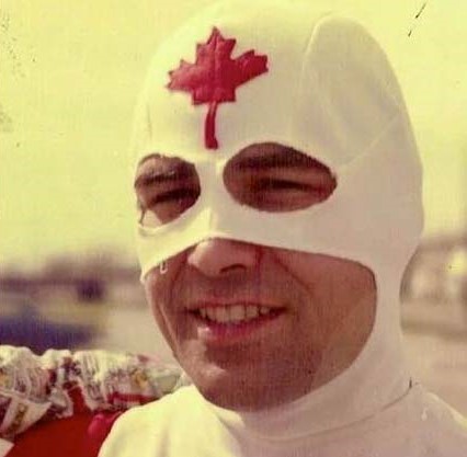 Colour photo of a man dressed in the Captain Canuck costume. He is smiling